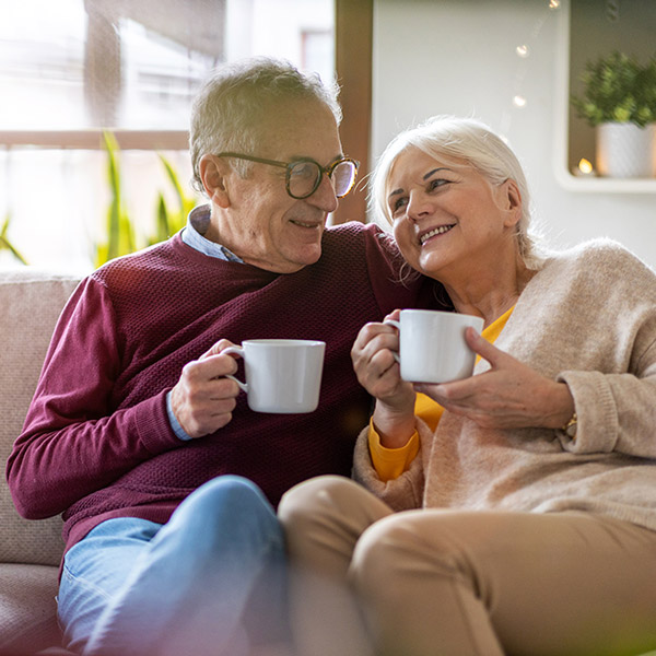 Senior Couple Enjoying Coffee After Heat Pump Repair in Edmonton & Spruce Grove