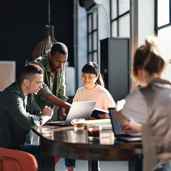 Coworkers Working in the Office after Commercial HVAC Repair Is Done in Spruce Grove & Edmonton