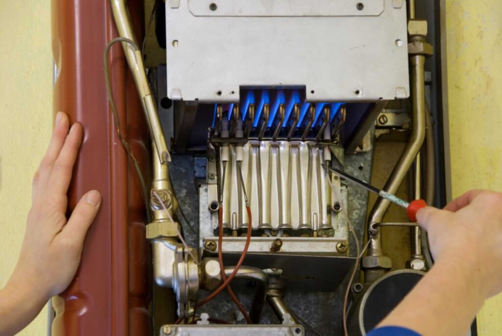 Furnace burner inspection during tune-up in Spruce Grove, AB